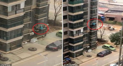 صينية مُسنة تنزل 8 طوابق على واجهة مبنى شاهق.. والسبب كورونا